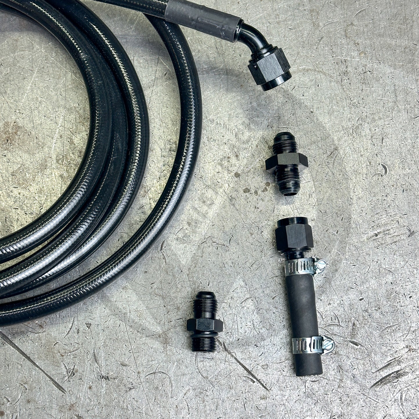 94-01 Integra E85 Compatible Black Stainless Steel Fuel Return Line | Regulator to Tank